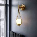 Złota lampa ścienna Roma