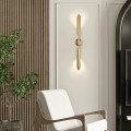 Złota lampa ścienna Locca